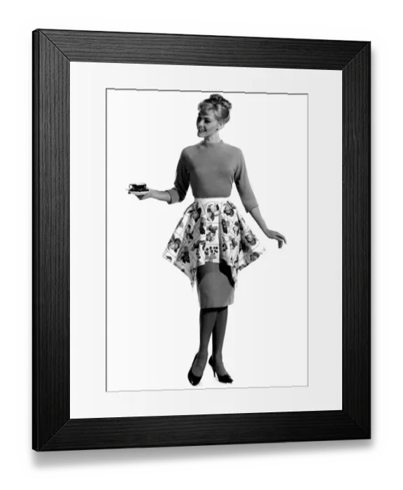 Framed Print : Model Jo Waning wearing knee length dress with floral patterned wrap around the waist Framed Print : Model Jo Waning wearing knee length dress with floral patterned wrap around the waist