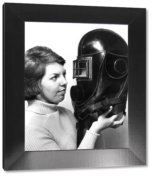 Jane Ectis looks at a mine rescue helmet on show at a Durham City exhibition in April