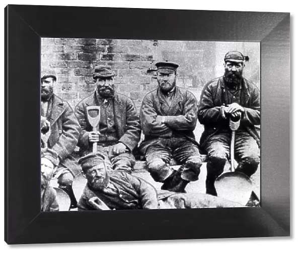A band of coal trimmers in about 1880. Their job was to level the coal on boats