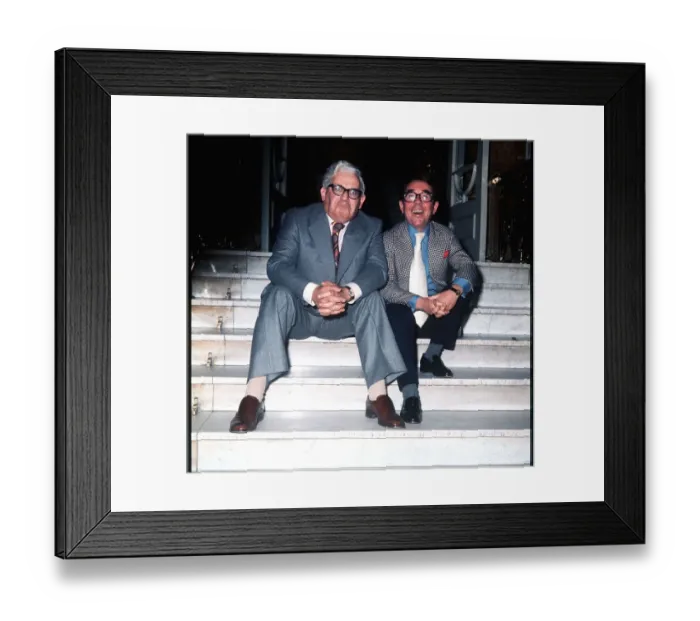 Framed Print : Ronnie Barker with Ronnie Corbett sitting on the steps outside the building Framed Print : Ronnie Barker with Ronnie Corbett sitting on the steps outside the building