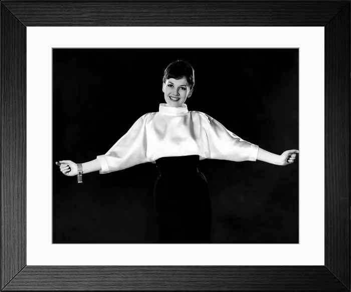 Framed Print : Woman wearing silk white shirt with black skirt. Reveille Fashions. Diana Lovell