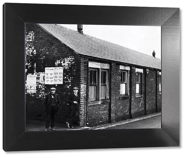 Two miners waiting outside the new social service centre at Burnhope colliery