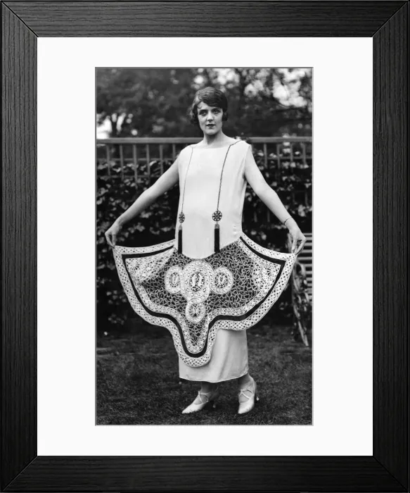 Framed Print : Woman wearing long white dress with circular patterns, Clothing. May 1924 P008661 Framed Print : Woman wearing long white dress with circular patterns, Clothing. May 1924 P008661