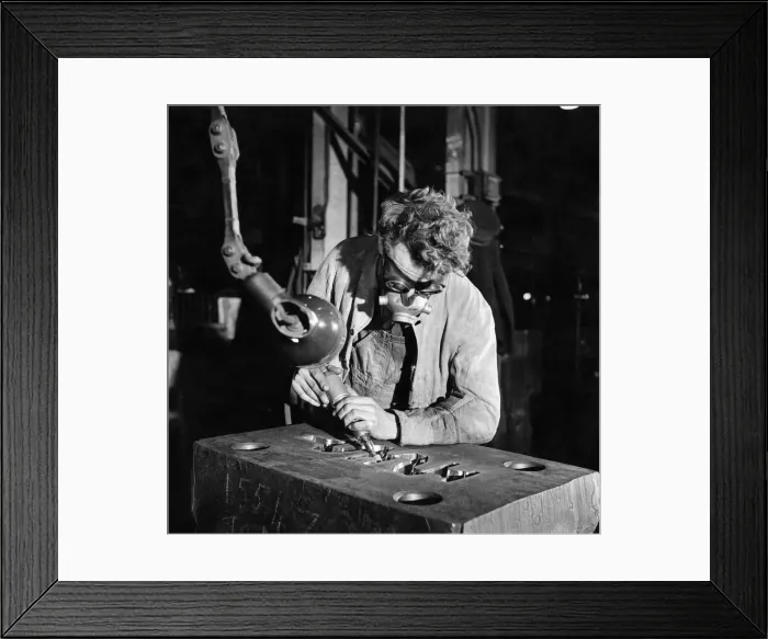 Framed Print : Even amid a welter of machines, some jobs can still only be done by hand Framed Print : Even amid a welter of machines, some jobs can still only be done by hand