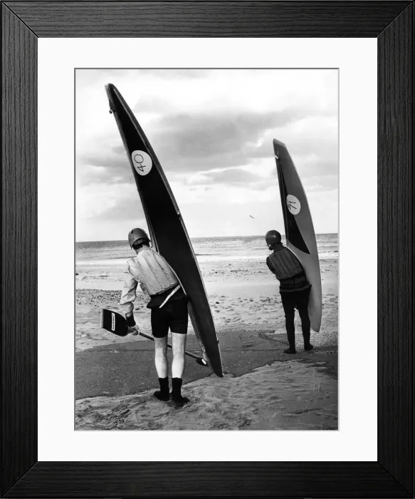 Framed Print : These surf canoeists don t seem to mind how miserable the weather is when it comes to Framed Print : These surf canoeists don t seem to mind how miserable the weather is when it comes to