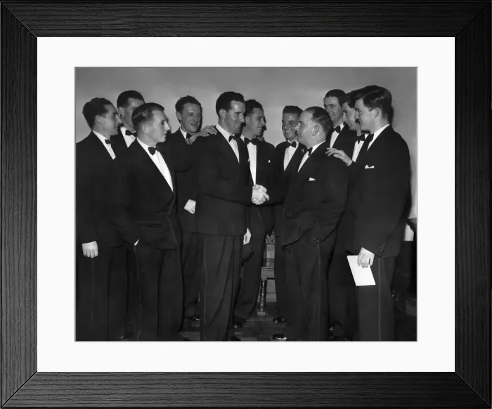 Framed Print : Lancashire cricketers look on as Ken Grieves (left) congratulates team captain Cyril Framed Print : Lancashire cricketers look on as Ken Grieves (left) congratulates team captain Cyril