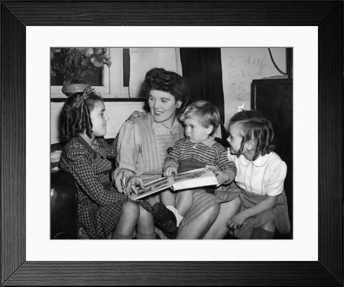 Framed Print : Mother reads a bedtime story to the children. December 1944 P010088 Framed Print : Mother reads a bedtime story to the children. December 1944 P010088