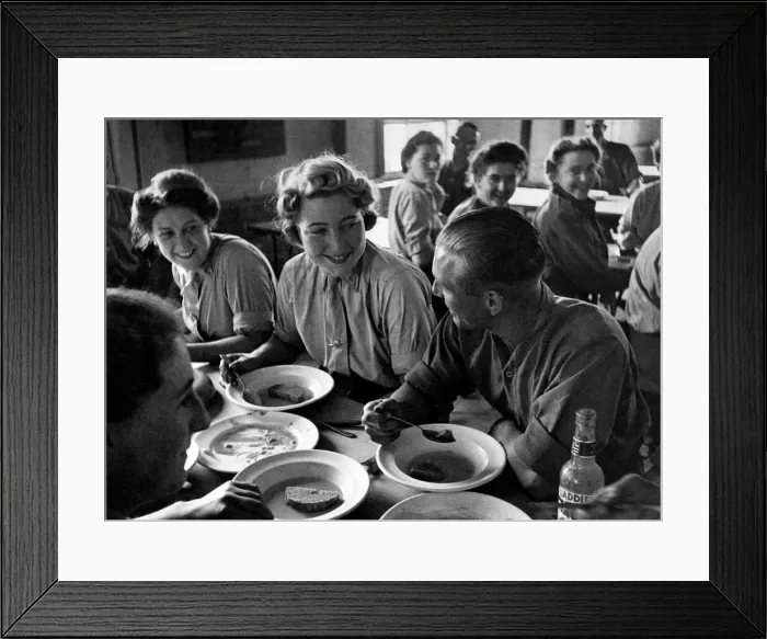 Framed Print : Is it romance at the dinner table? Scene at a mixed a Battery in the London area