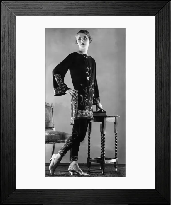 Framed Print : Woman wearing floral patterned top with flared sleeves with matching trousers July Framed Print : Woman wearing floral patterned top with flared sleeves with matching trousers July