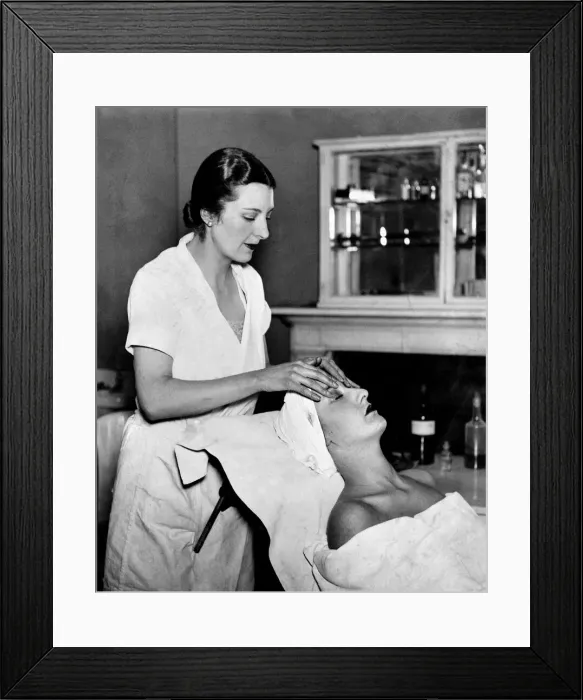 Framed Print : Woman sitting down realxing having beauty treatment and massage done