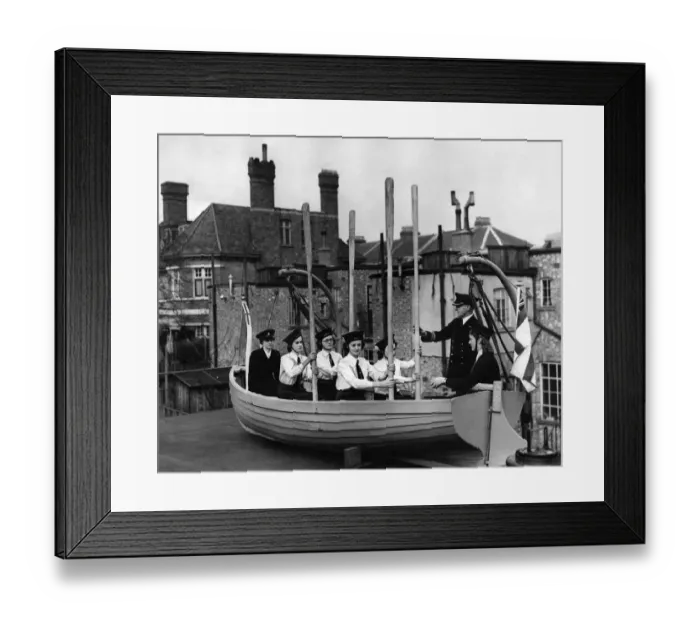 Framed Print : Naval training corp girls learning how to row a boat during the war Framed Print : Naval training corp girls learning how to row a boat during the war