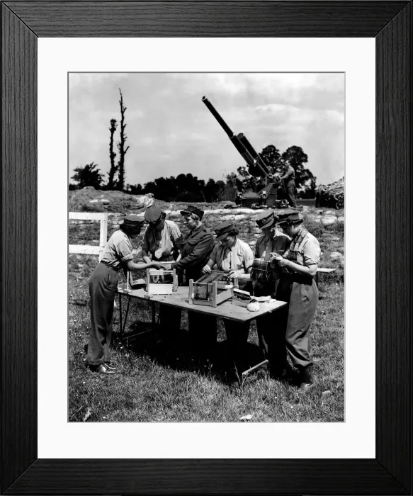 Framed Print : Girls at work, with gun in background. June 1942 P010186 Framed Print : Girls at work, with gun in background. June 1942 P010186