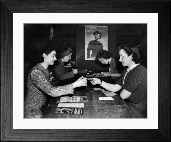Framed Print : A woman registers for war work at the Burnt Oak labours exchange after they marked Framed Print : A woman registers for war work at the Burnt Oak labours exchange after they marked