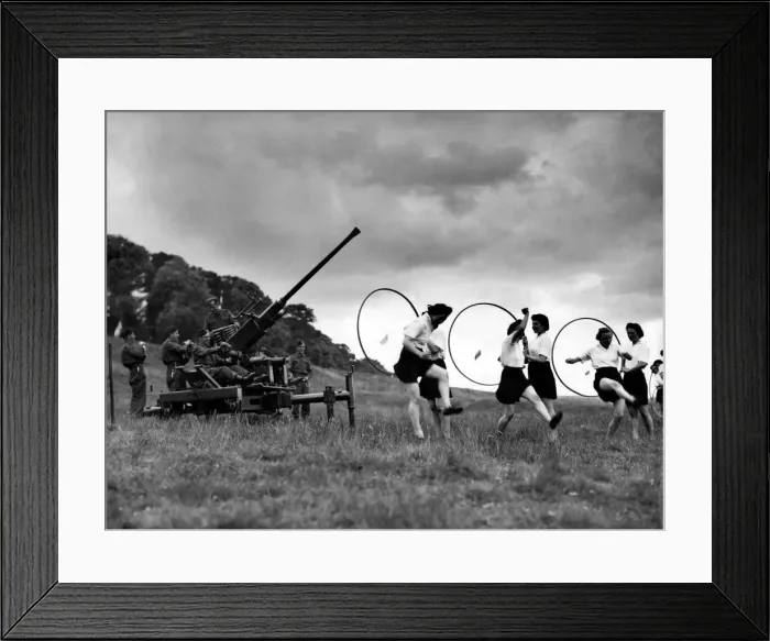 Framed Print : Member of the ATS seen taking exercise at a Anti Aircraft gun emplacement Framed Print : Member of the ATS seen taking exercise at a Anti Aircraft gun emplacement