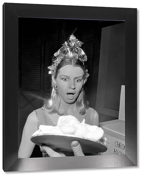 Sara Wade about to have a custard pie thrown at her. January 1970