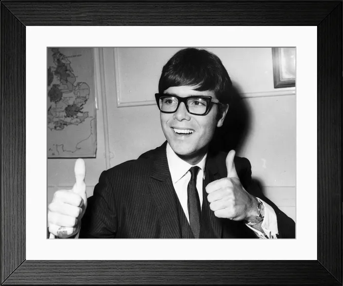 Framed Print : Cliff Richard Actor / Singer giving the thumbs up sign Framed Print : Cliff Richard Actor / Singer giving the thumbs up sign