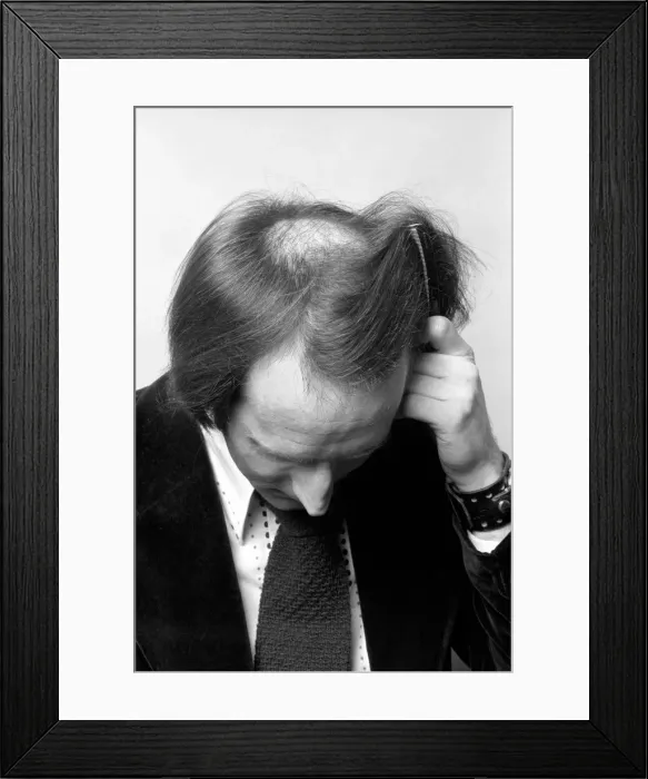 Framed Print : Man combing his hair. July 1975 75-00177-006