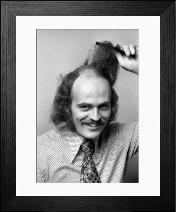 Framed Print : Man combing his hair. July 1975 75-00177-004