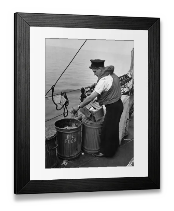 Framed Print : Nothing is wasted at Sea. Picture shows seaman placing waste in salvage tins so familiar Framed Print : Nothing is wasted at Sea. Picture shows seaman placing waste in salvage tins so familiar