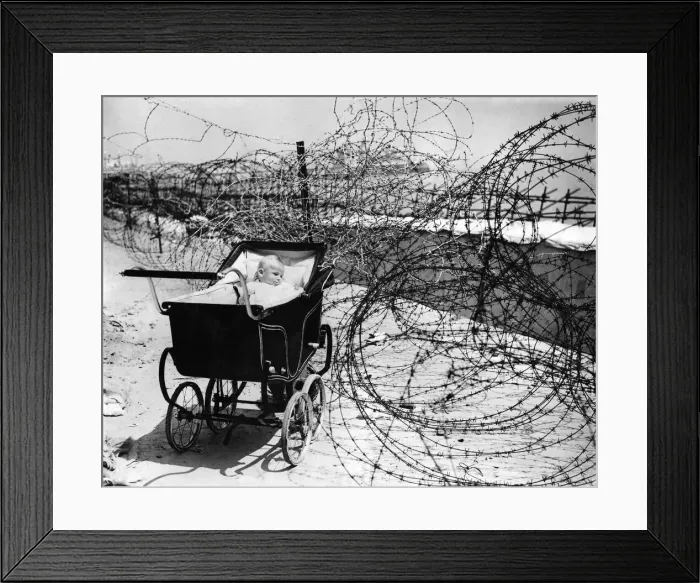 Framed Print : World War II: Home front. Baby enjoys the sea air as best she can Framed Print : World War II: Home front. Baby enjoys the sea air as best she can