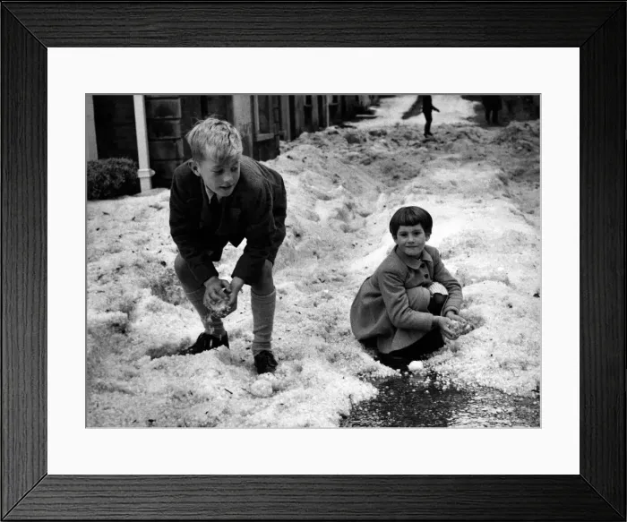 Framed Print : Snowballs'of hailstones brought fun for these children in Castle Street