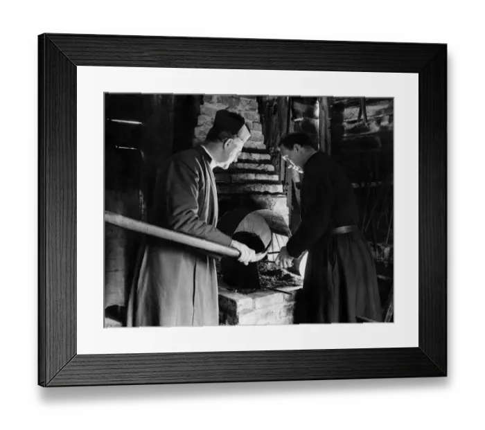 Framed Print : Father Ward and a brother testing the forge which he has re-erected. April 1937 P009950