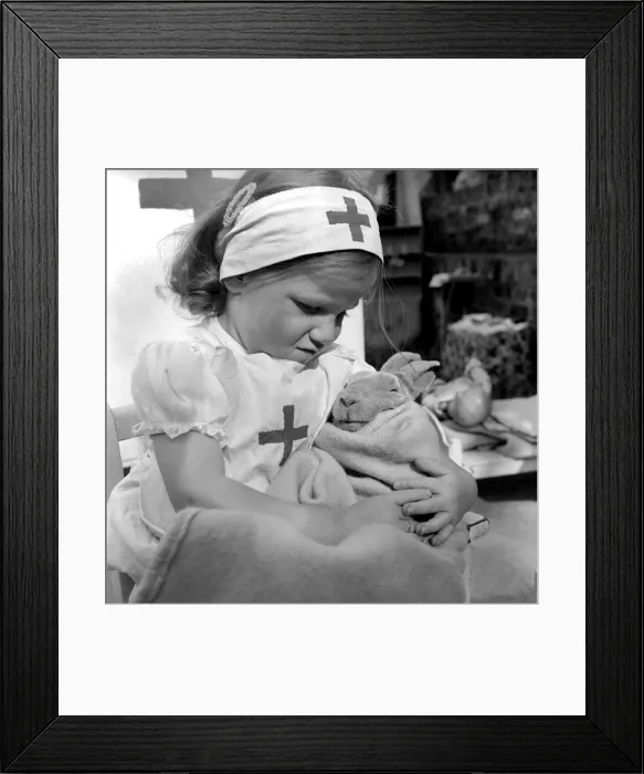 Framed Print : Rita is only three and she knows that ladies with a Red cross on them tend carefully to Framed Print : Rita is only three and she knows that ladies with a Red cross on them tend carefully to