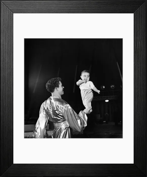 Framed Print : Baby Bobbie'Mohamed Ben Mohamed Ali, balancing on his Uncles hand Framed Print : Baby Bobbie'Mohamed Ben Mohamed Ali, balancing on his Uncles hand