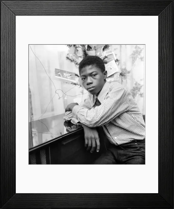 Framed Print : Pictured at his sisters home in Ilford, 13 year old Ebenezer Baidoo waiting by