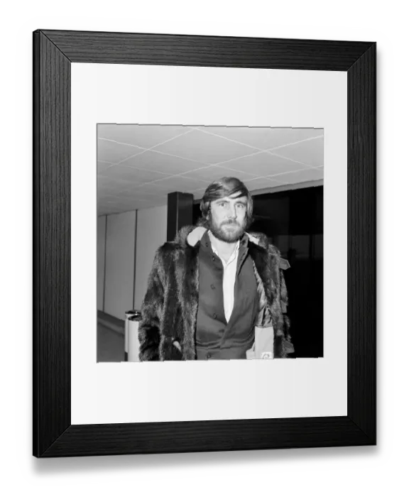Framed Print : George Lazenby arrived at Heathrow Airport today from San Francisco Framed Print : George Lazenby arrived at Heathrow Airport today from San Francisco