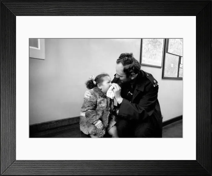Framed Print : Police and Children. The scene is set in the enquiry office of Bishopsgate Police Station