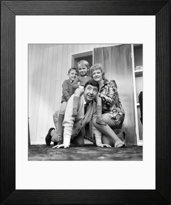 Framed Print : People: Families. Man at home with his wife and playing with children Framed Print : People: Families. Man at home with his wife and playing with children