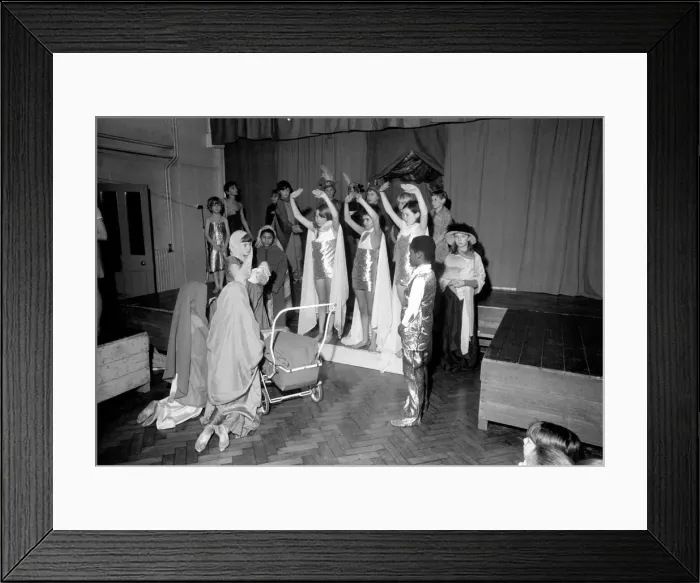 Framed Print : A Hippie street singer, and Mary pushing a pram, were part of a school Framed Print : A Hippie street singer, and Mary pushing a pram, were part of a school