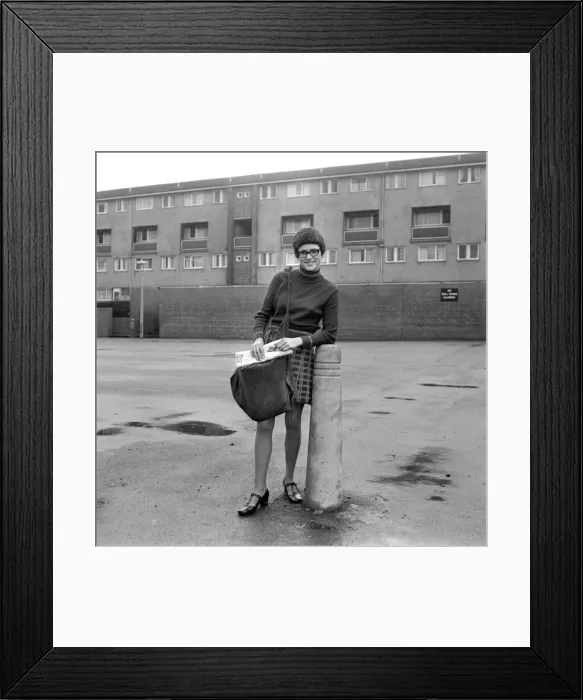 Framed Print : Teenage girl from Toxteth in Liverpool delivering newspapers on a paper round