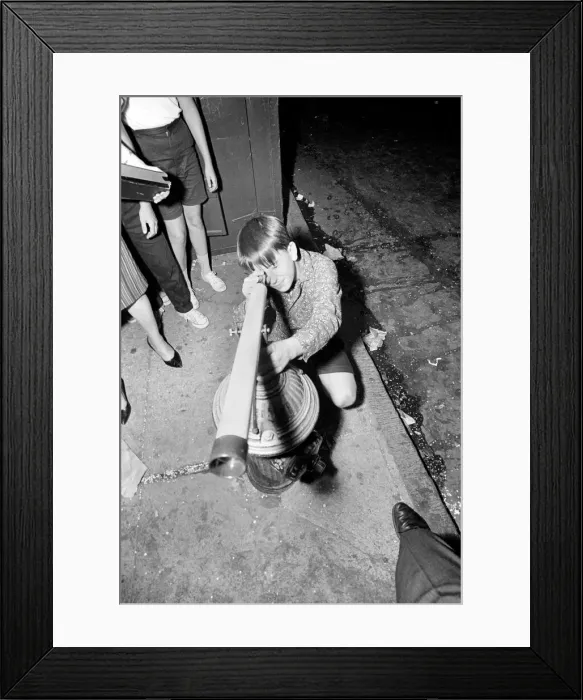 Framed Print : A young Beatles fan tries to get a closer view of his idols on the streets of New York Framed Print : A young Beatles fan tries to get a closer view of his idols on the streets of New York