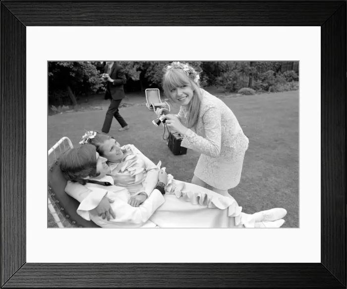 Framed Print : Mike McCartneys Wedding. Jane Asher takes a photograph of the bride Framed Print : Mike McCartneys Wedding. Jane Asher takes a photograph of the bride
