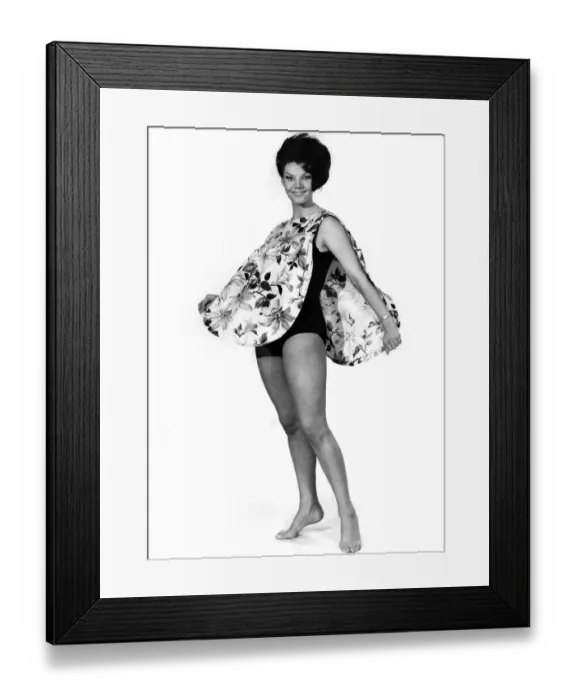 Framed Print : Reveille Fashions 1966: Jo-Ann Asher modelling a beach bib. May 1966 P006598