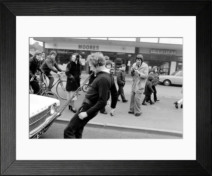 Framed Print : Strongman Reg Morris pulls car and passengers with his teeth. February 1975 75-00777-009 Framed Print : Strongman Reg Morris pulls car and passengers with his teeth. February 1975 75-00777-009