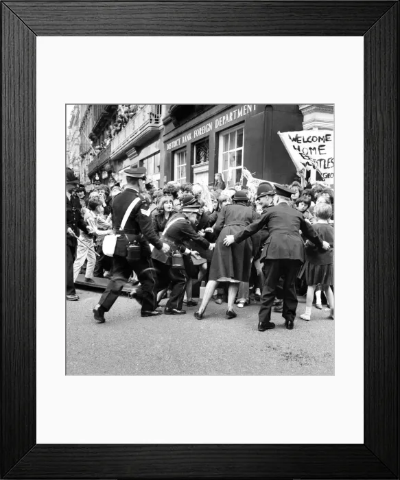 Framed Print : Police try to control fans in the streets of Liverpool before the premiere of the Beatles