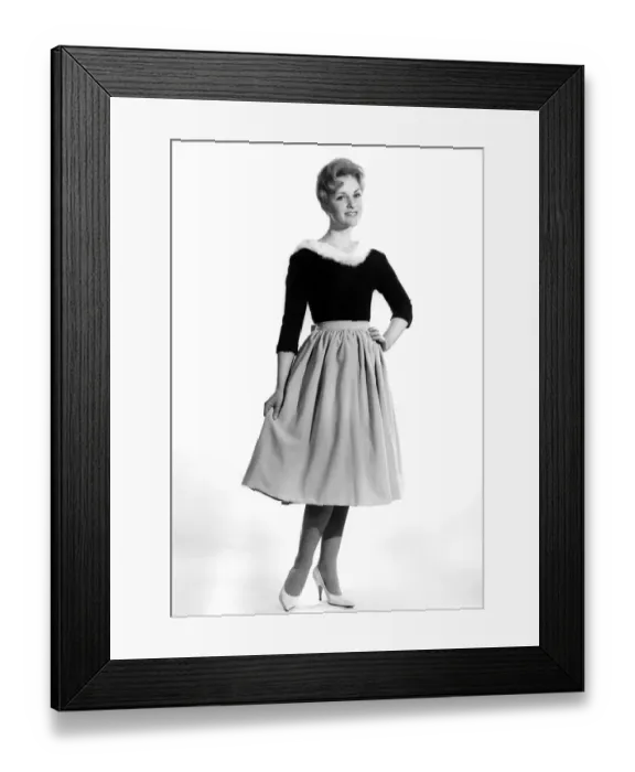 Framed Print : Reveille Fashions 1961: Roma Reeves modelling a fur trimmed sweater and skirt