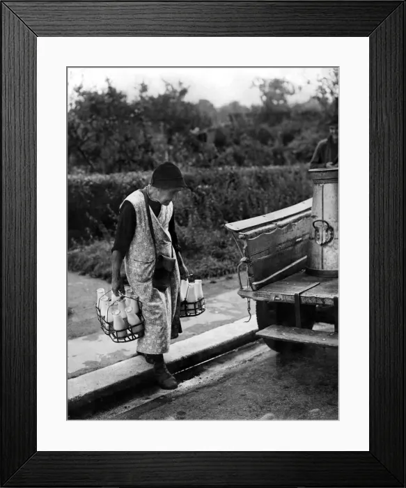 Framed Print : Mrs. Harriet Spencer aged 86, loading her milk float ready for the morning round which Framed Print : Mrs. Harriet Spencer aged 86, loading her milk float ready for the morning round which