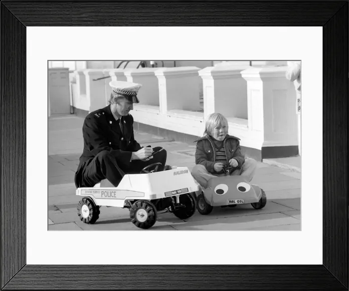 Framed Print : 1975 Brighton Toy Fair. Police cut backs mean this traffic cop can only pull over Framed Print : 1975 Brighton Toy Fair. Police cut backs mean this traffic cop can only pull over