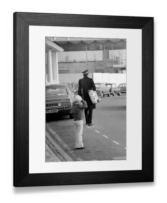 Framed Print : 1975 Brighton Toy Fair. Small boy cries as Traffic Warden confiscate toy pedal car for
