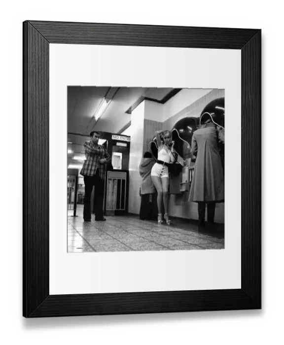 Framed Print : Model Christine Donna seen here using the public telephones at Holborn tube station