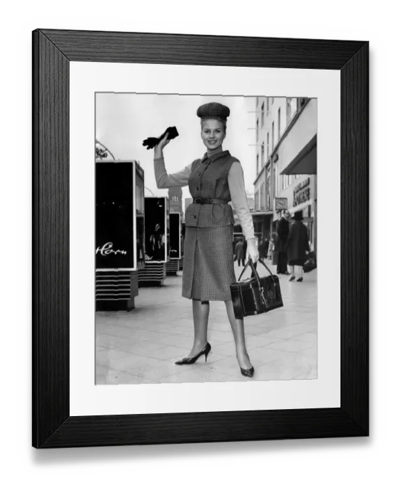 Framed Print : Clothing 1963. Woman wearing a tweed jacket and skirt with handbag and gloves