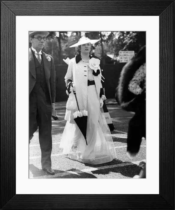 Framed Print : Sunshine day at Royal Ascot. Second day. One of the many female racegoers wearing a full