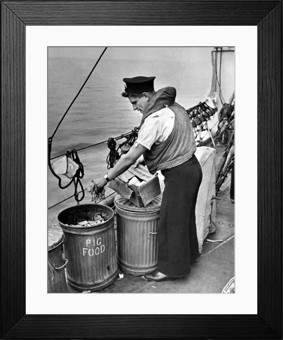 Framed Print : Nothing to wasted at sea. Seaman placing waste in salvage tins so familiar to Framed Print : Nothing to wasted at sea. Seaman placing waste in salvage tins so familiar to
