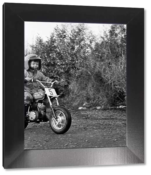 Child  /  Boy  /  Motorbike: Garry Jess, 3, ride minibike. January 1975 75-00555