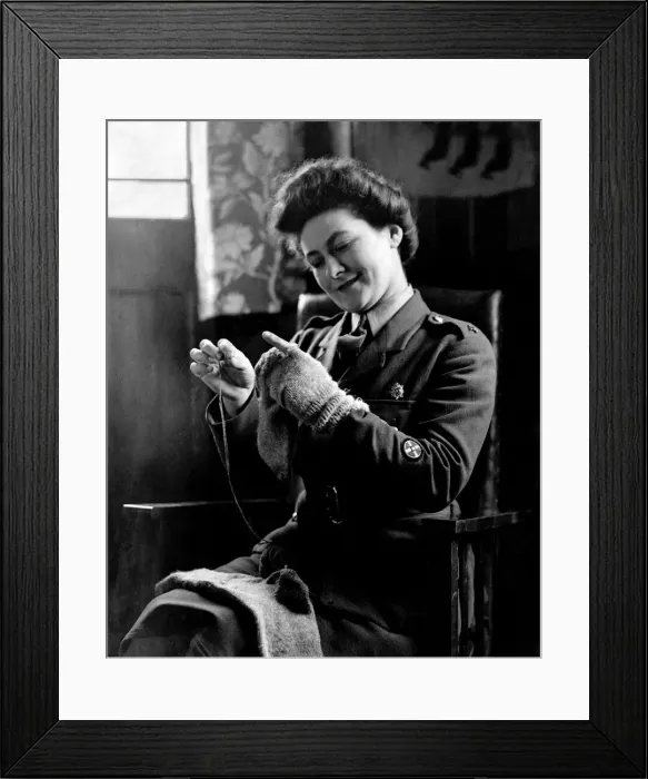 Framed Print : World War II Women: Camp Romance. Private Dorothy Brownlow darns her husband socks Framed Print : World War II Women: Camp Romance. Private Dorothy Brownlow darns her husband socks