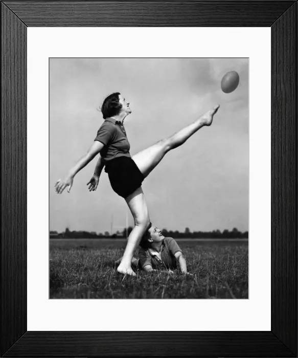 Framed Print : The high kicker of the rugby team kicking the ball during a game of rugby Framed Print : The high kicker of the rugby team kicking the ball during a game of rugby